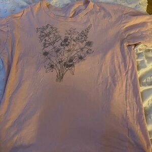 pink shirt sleeve t-shirt. flowers on the front, nothing on the back.